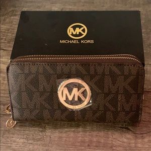 Brand new Michael Kors brown wallet.